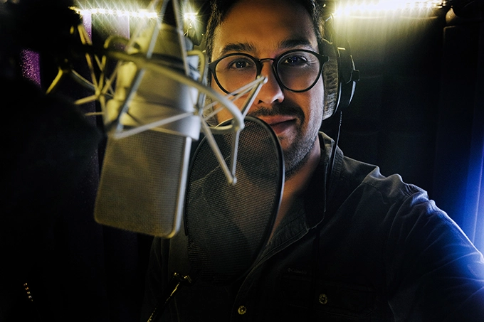 portrait of Marcos Fernandes, voice actor from Portugal, in the audio booth